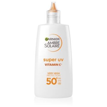 Garnier Ambre Solaire Super UV Vitamin C fluid protecție impotriva petelor intunecate